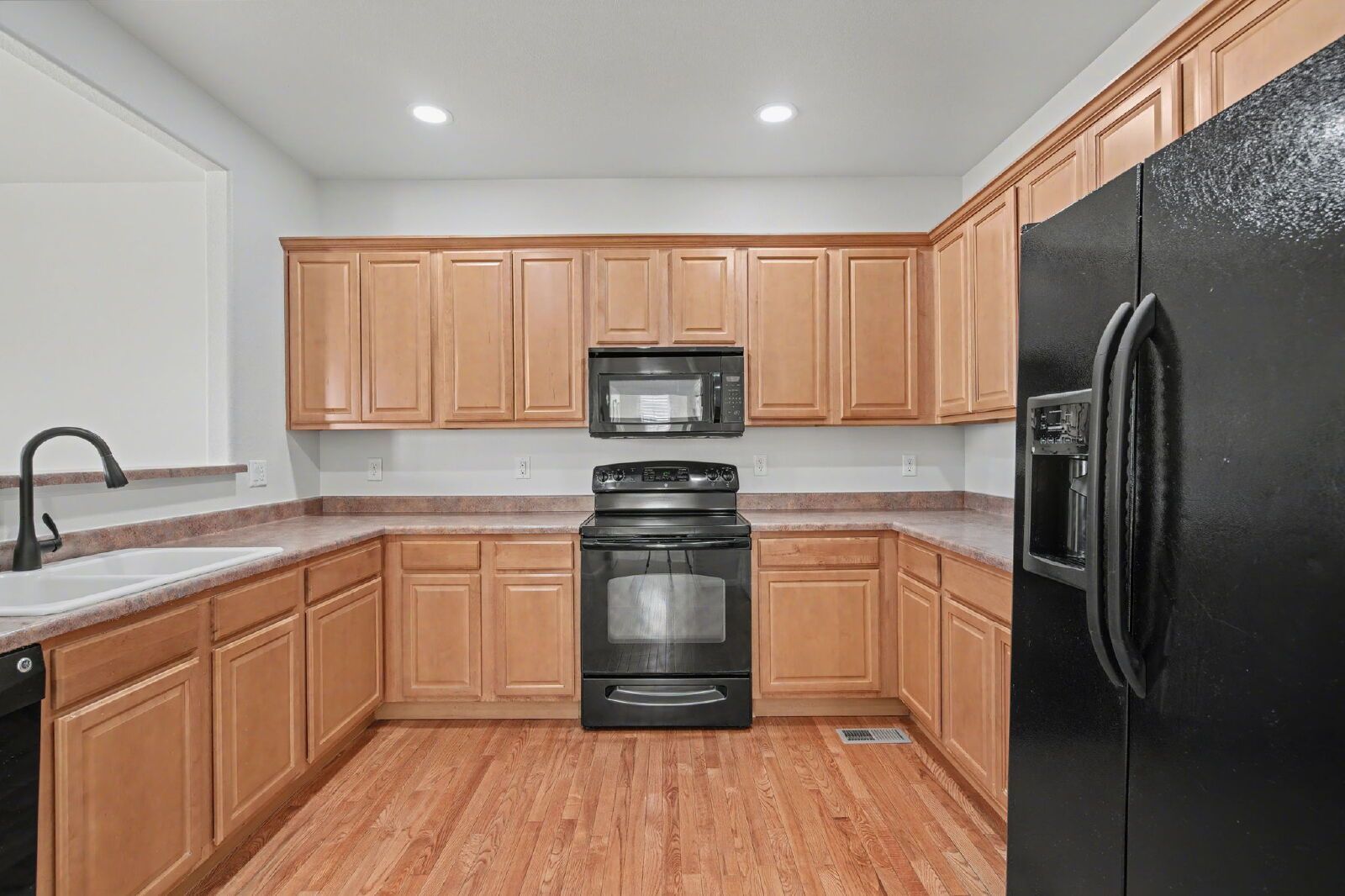 Beautifully Updated 3-Bedroom End-Unit Townhome Facing Open Space with Attached 2-Car Garage in Gated Sand Creek Villas property image