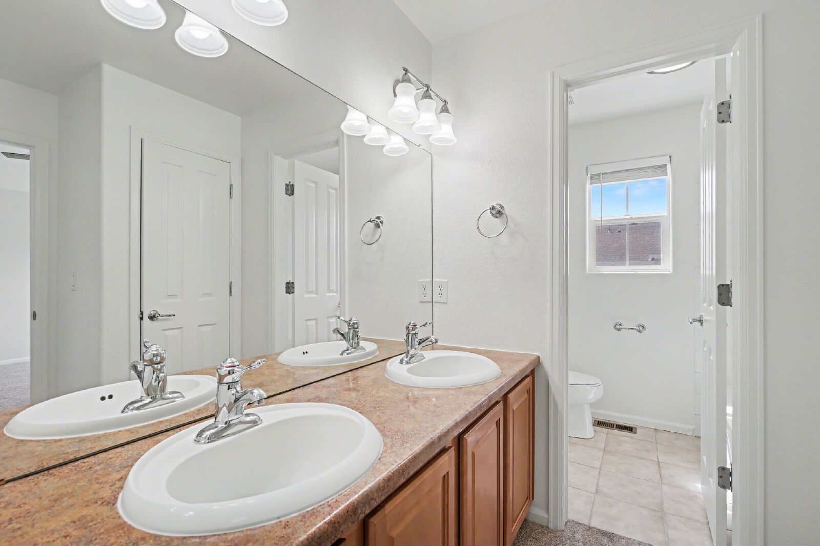 Beautifully Updated 3-Bedroom End-Unit Townhome Facing Open Space with Attached 2-Car Garage in Gated Sand Creek Villas property image