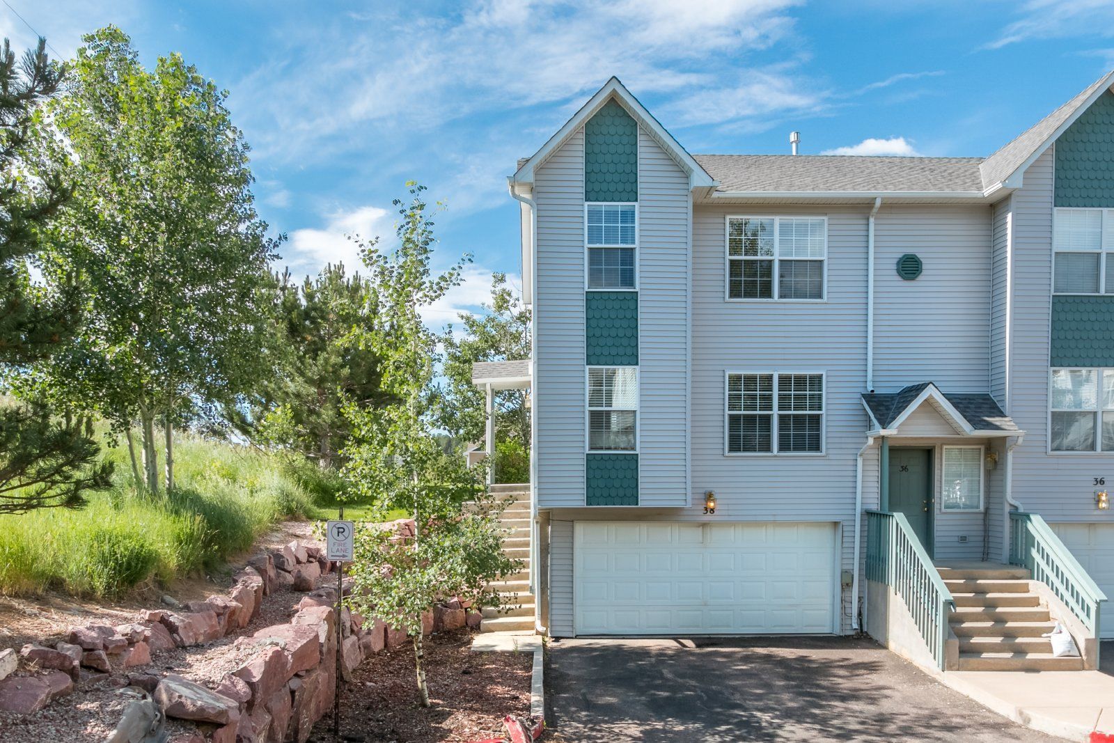 Spacious 3-Bedroom Townhome with Main-Level Primary Suite and Gas Fireplace in Palmer Lake – Water, Sewer & Trash Included property image