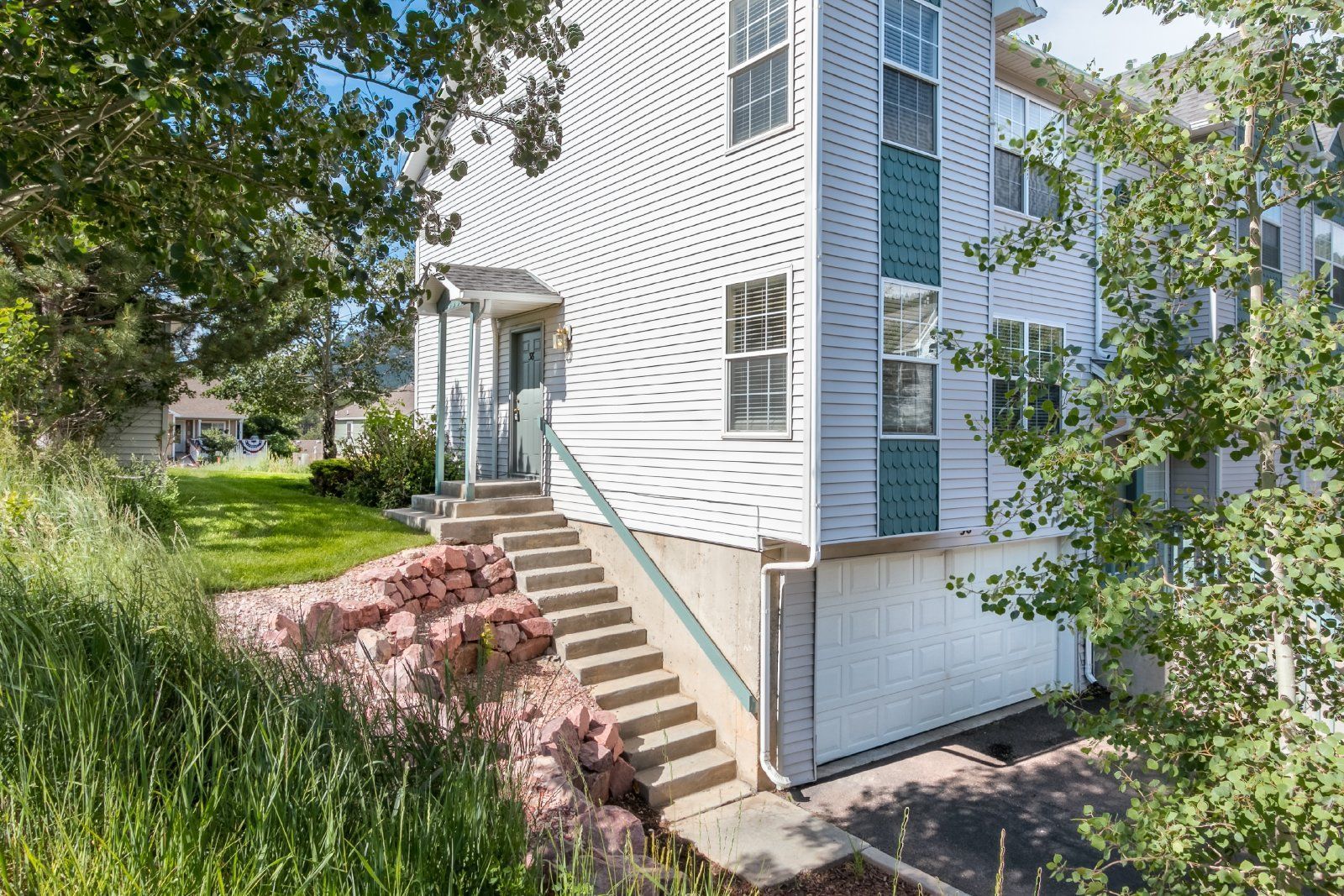 Spacious 3-Bedroom Townhome with Main-Level Primary Suite and Gas Fireplace in Palmer Lake – Water, Sewer & Trash Included property image